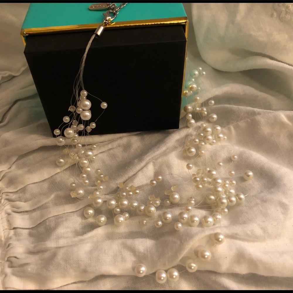 Seed pearls strung on clear line